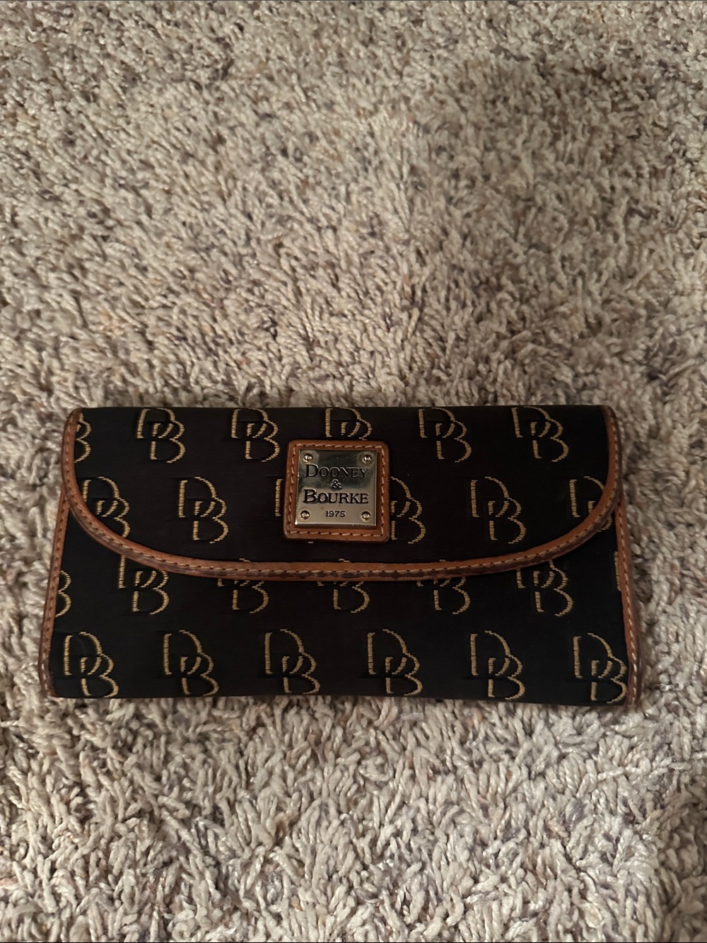 Dooney & Bourke Black Wallet with Brown Trim and Logo Plate